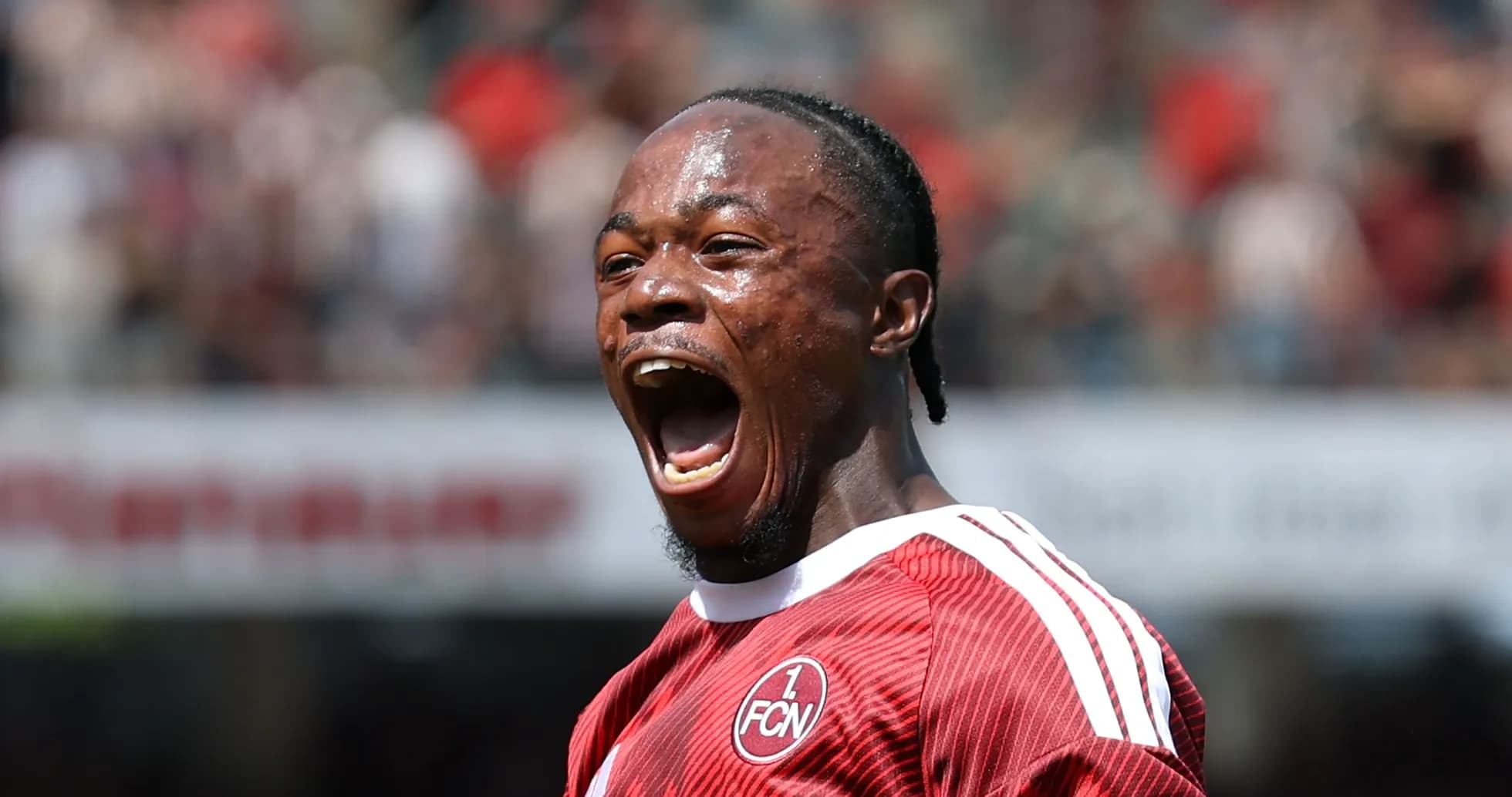 Player celebrating a goal with open mouth Player celebrating a goal with open mouth