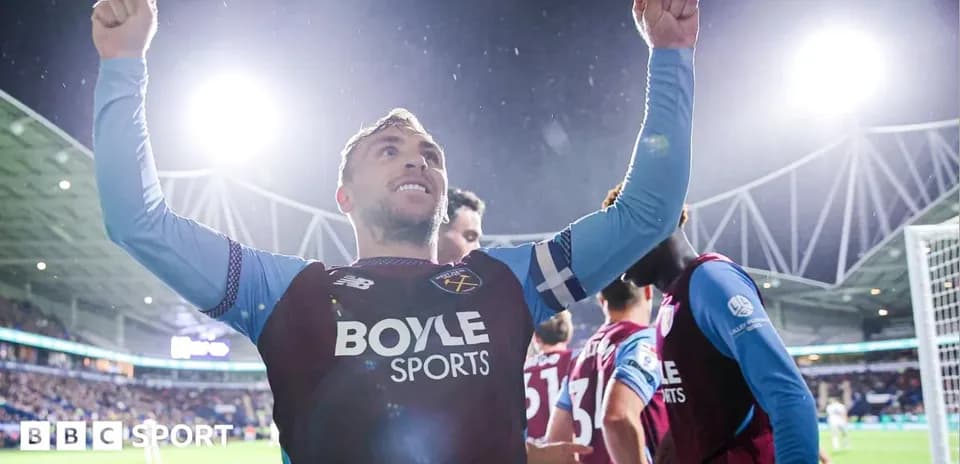 Player celebrating with raised arms after scoring Player celebrating with raised arms after scoring