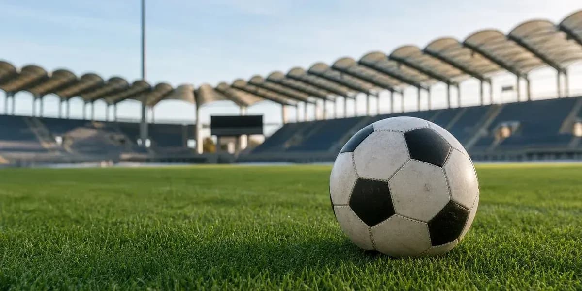 Soccer ball on grass at empty stadium Soccer ball on grass at empty stadium