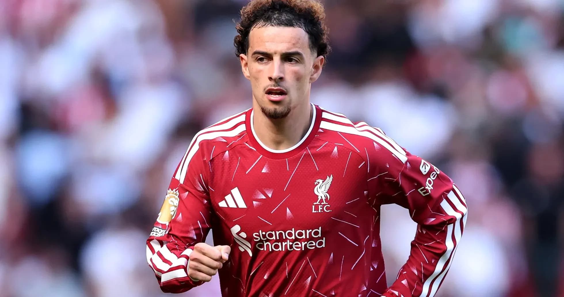 Liverpool player running on the pitch during match Liverpool player running on the pitch during match