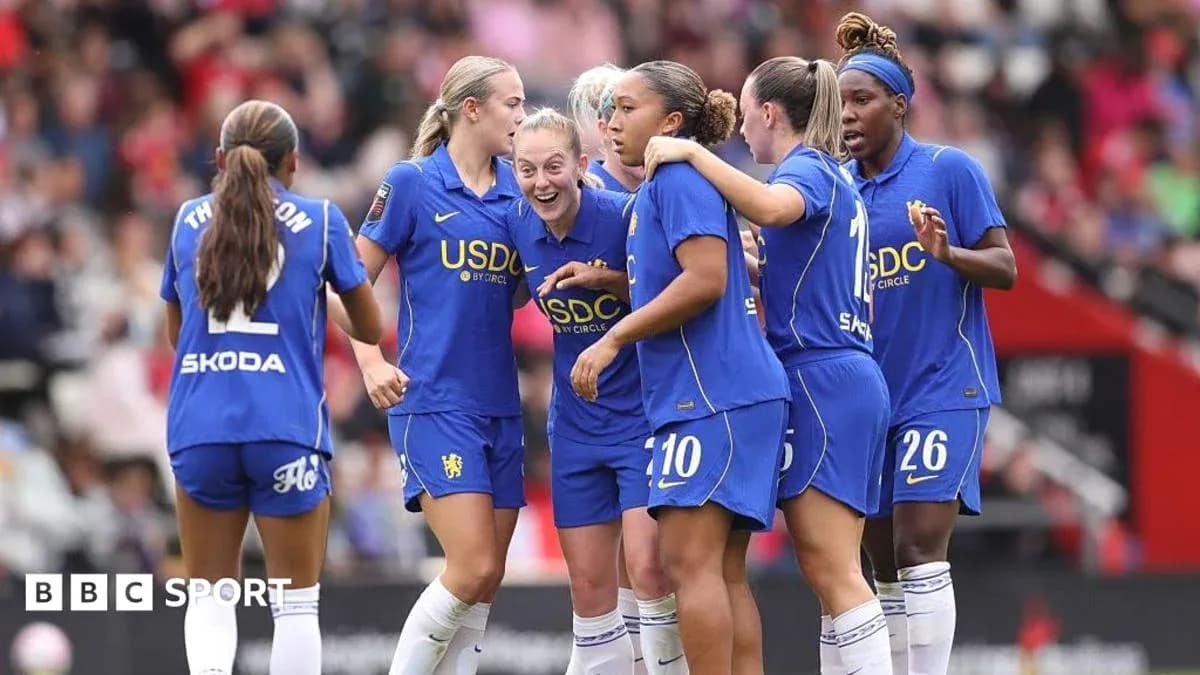 Chelsea women's team celebrating a goal on the pitch Chelsea women's team celebrating a goal on the pitch