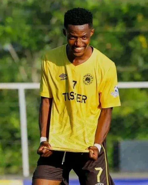 Player celebrating in yellow team jersey during match Player celebrating in yellow team jersey during match