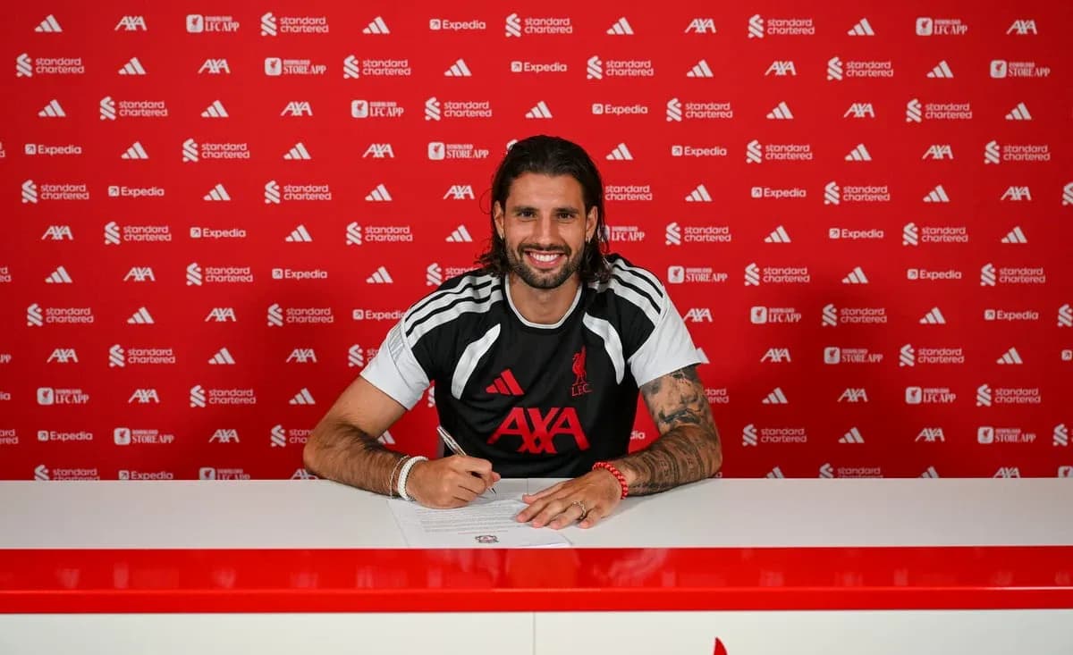 Player signing contract at Liverpool FC press conference Player signing contract at Liverpool FC press conference