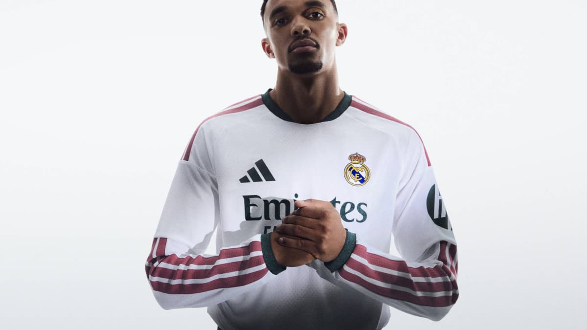 Player wearing Real Madrid jersey with hands clasped Player wearing Real Madrid jersey with hands clasped