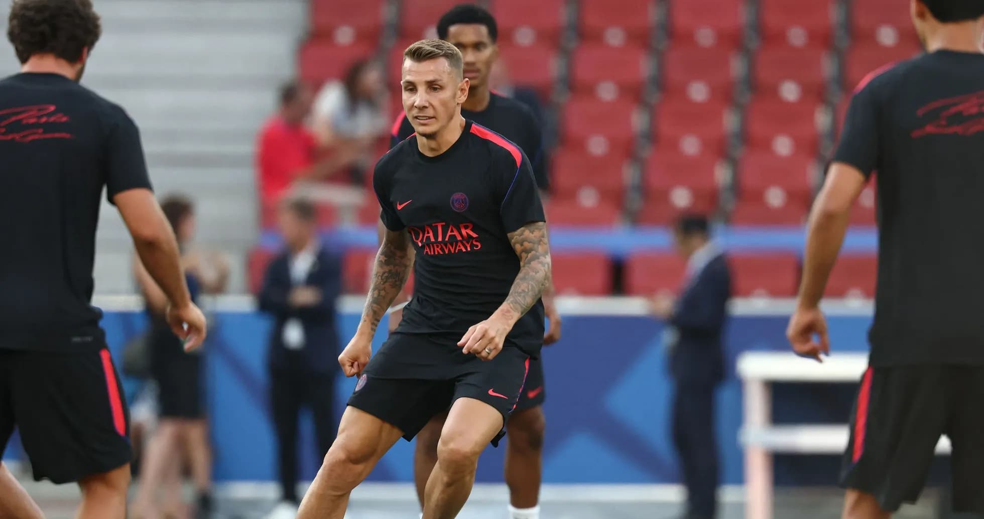 Player training on the pitch before a match Player training on the pitch before a match