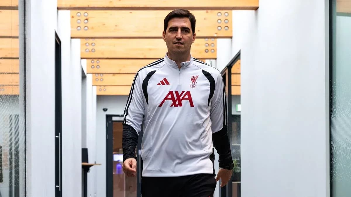 Coach walking through training facility hallway Coach walking through training facility hallway