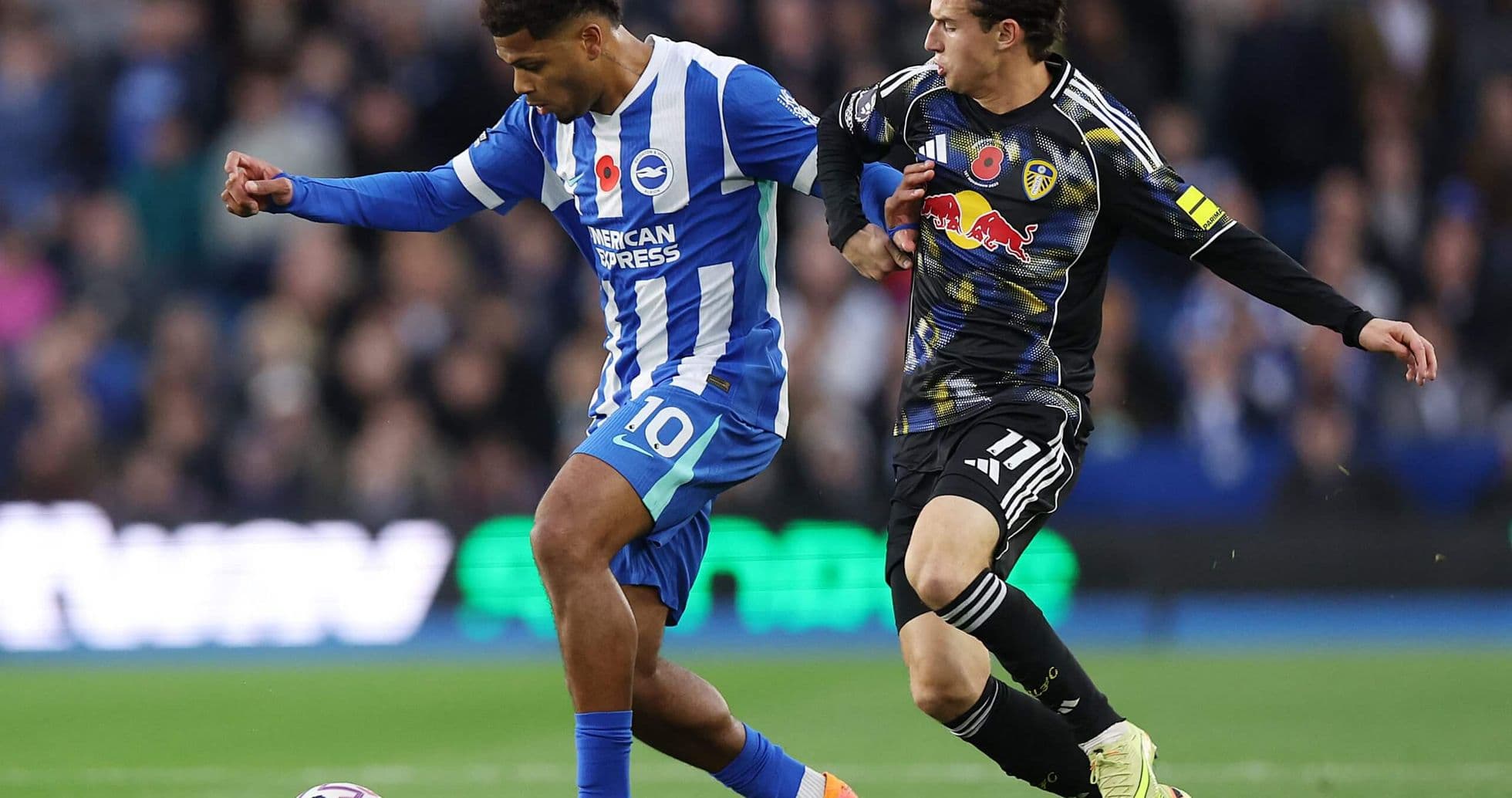Brighton player challenged by Leeds opponent Brighton player challenged by Leeds opponent