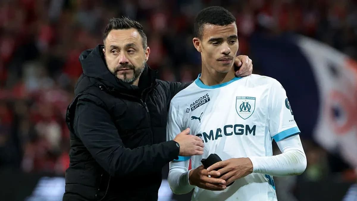 Coach comforting player after match at stadium Coach comforting player after match at stadium
