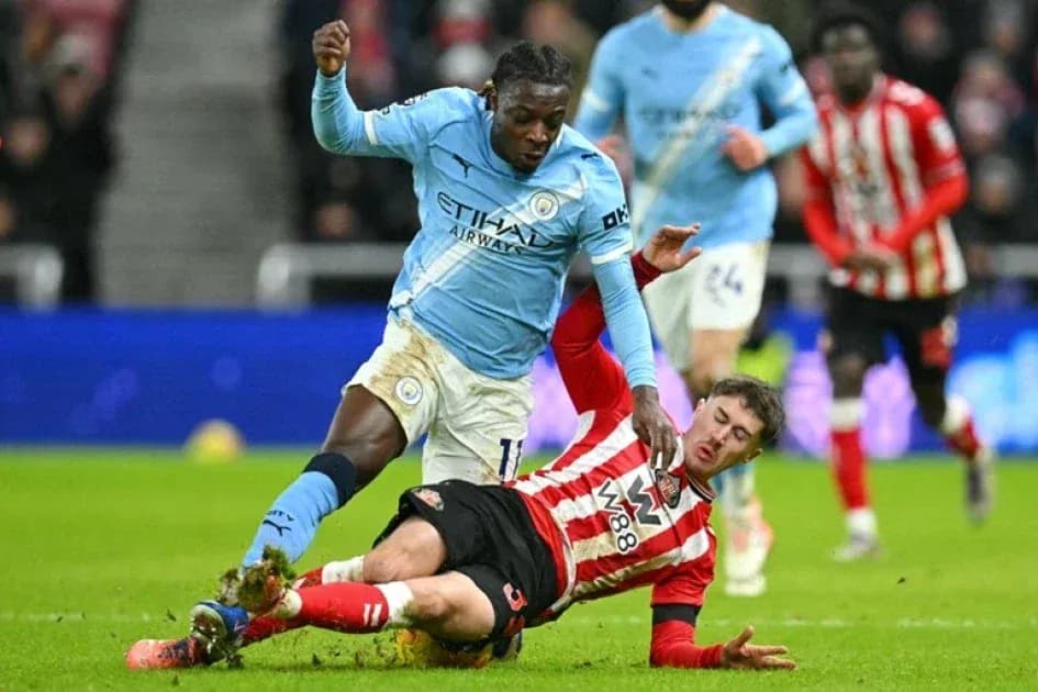 Player tackling opponent during a football match Player tackling opponent during a football match