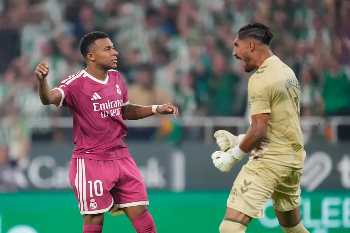 Player celebrating with goalkeeper during match Player celebrating with goalkeeper during match