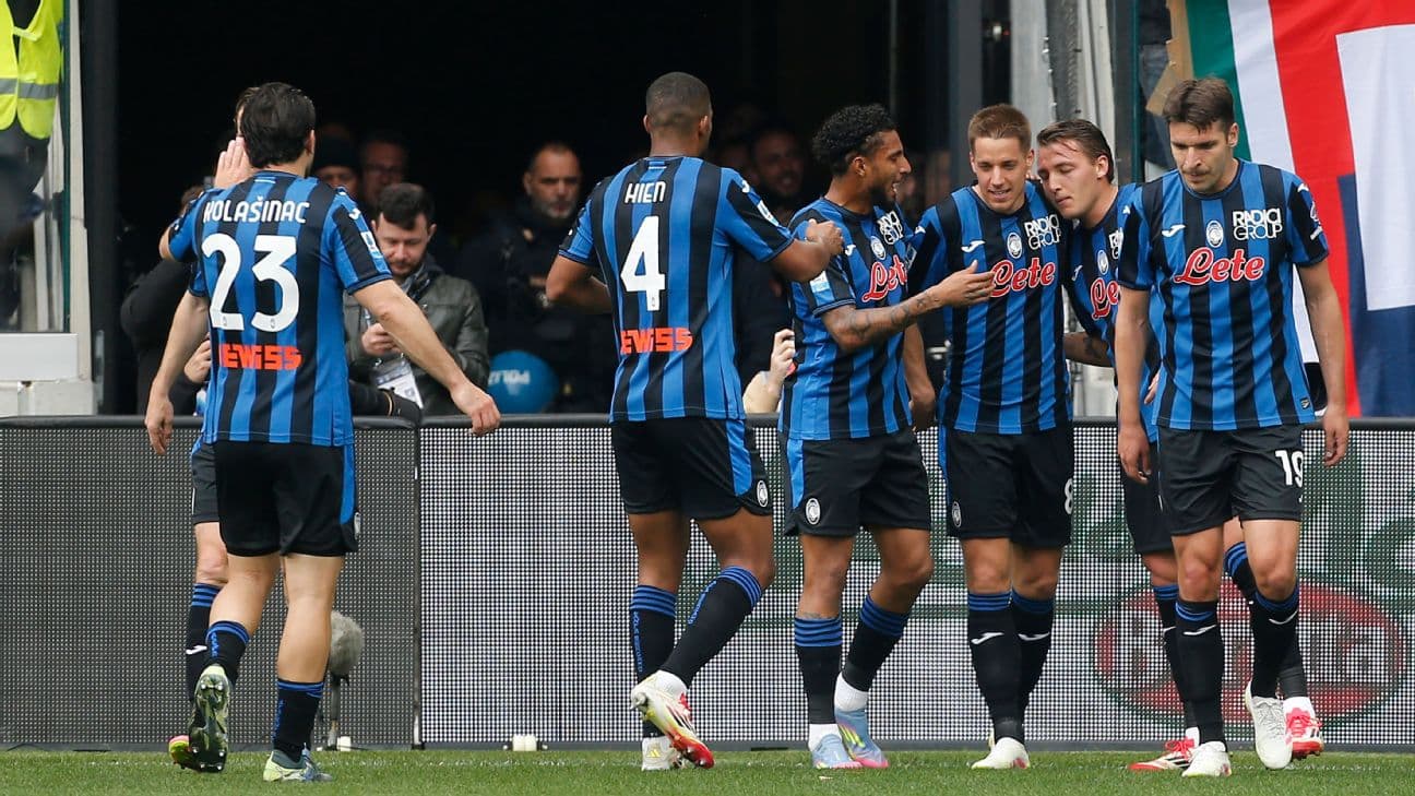 Atalanta players celebrating a goal together Atalanta players celebrating a goal together