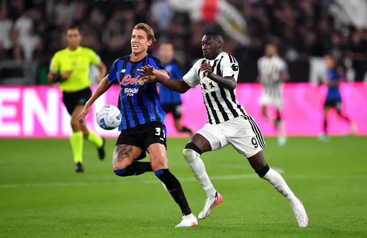 Player challenging for the ball during match Player challenging for the ball during match