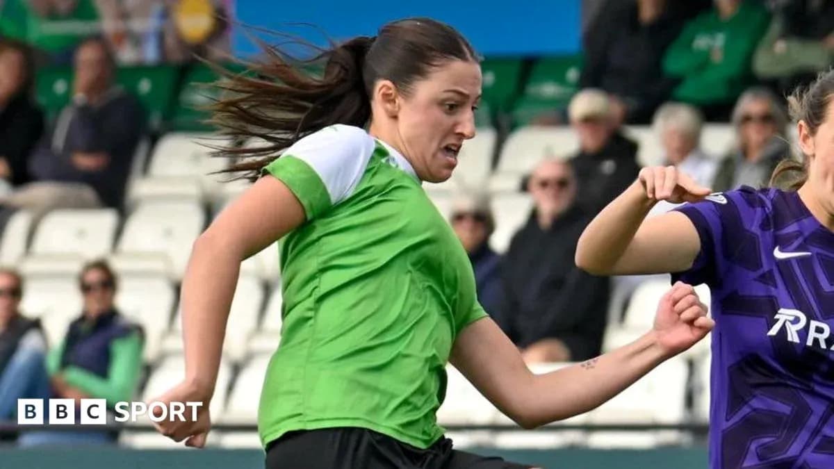 Player in green dribbling the ball during match Player in green dribbling the ball during match