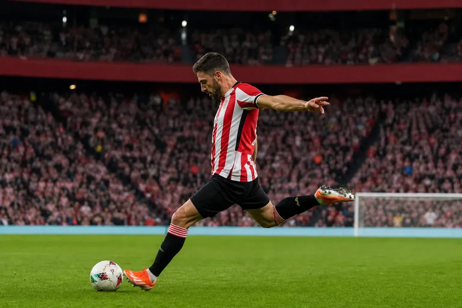 Player taking a free kick during a match Player taking a free kick during a match