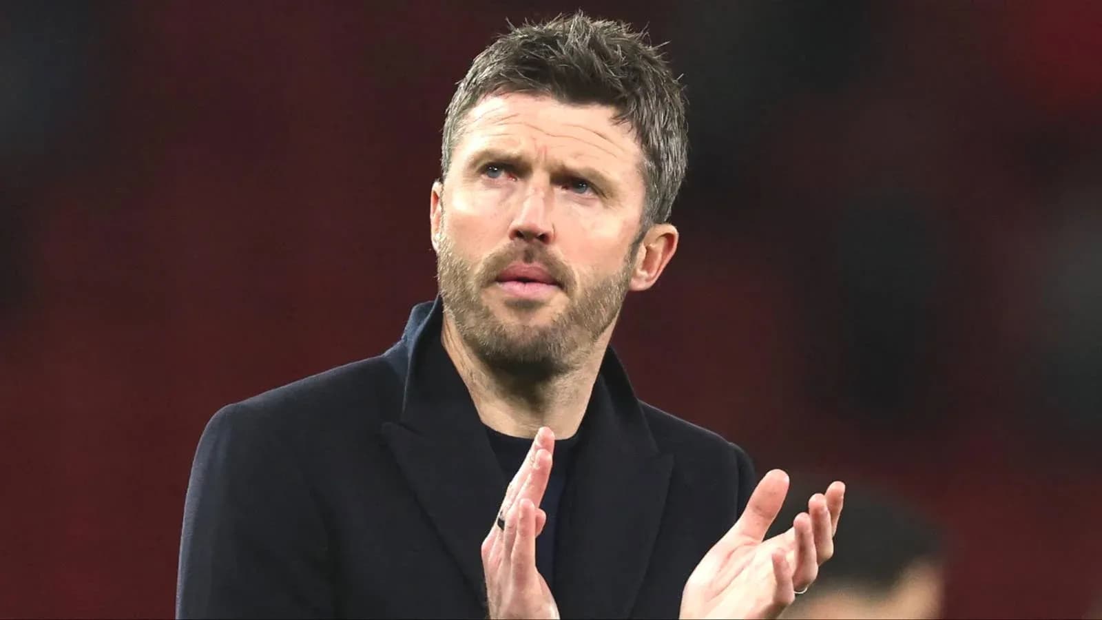 Manager applauding during match at stadium Manager applauding during match at stadium