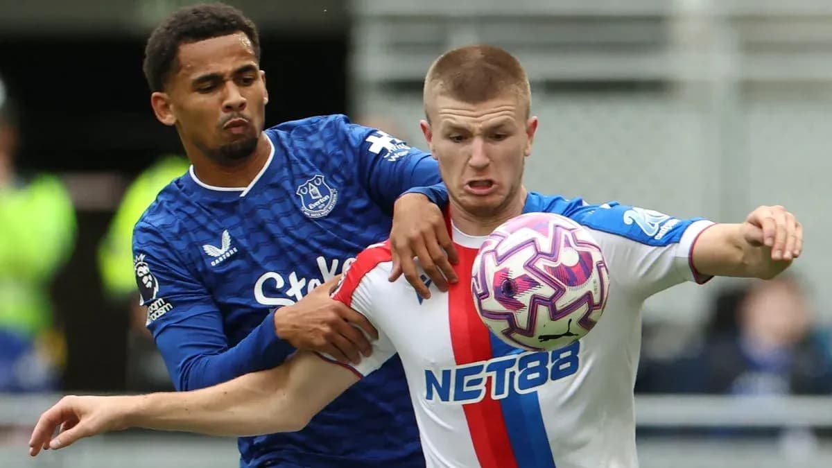 Player from Everton challenging Crystal Palace opponent for ball Player from Everton challenging Crystal Palace opponent for ball
