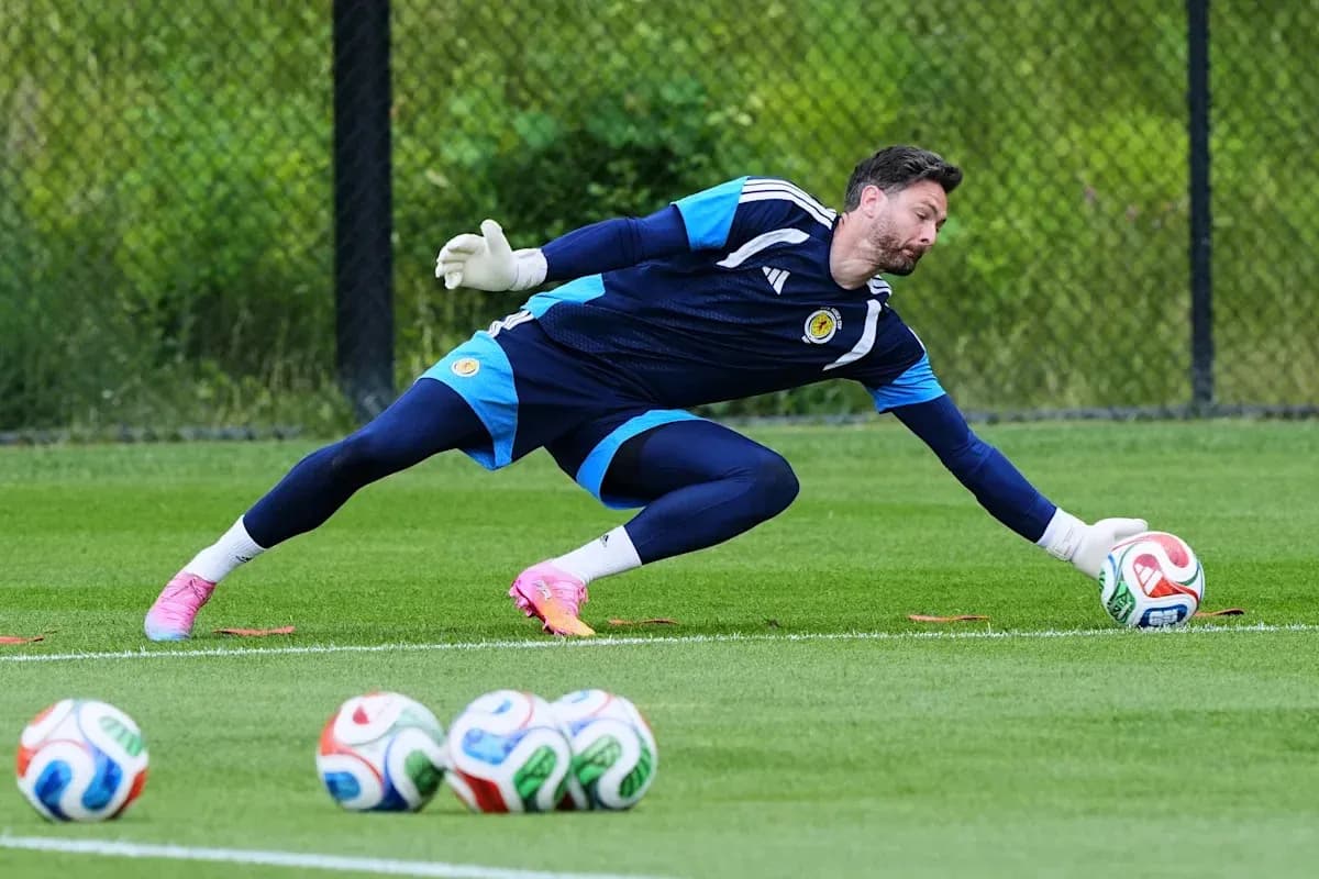 Goalkeeper diving to save a soccer ball during practice Goalkeeper diving to save a soccer ball during practice