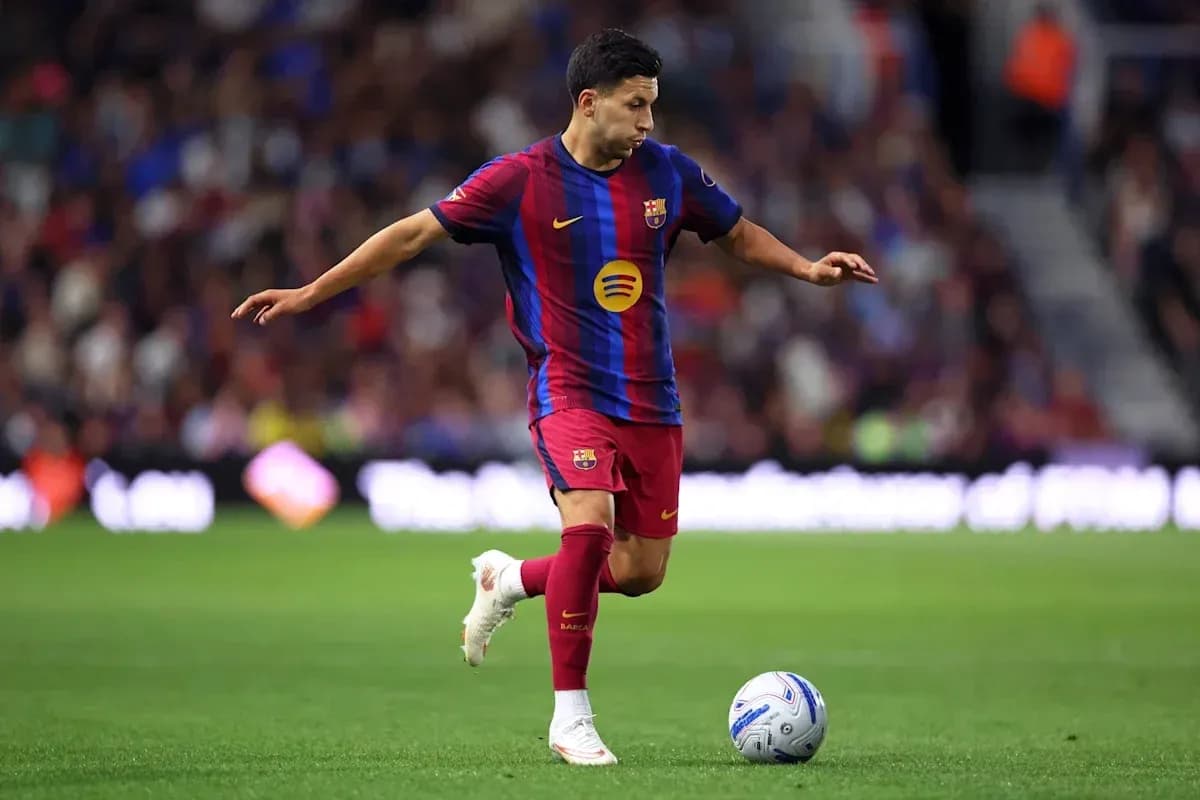 Player from FC Barcelona dribbling the ball Player from FC Barcelona dribbling the ball
