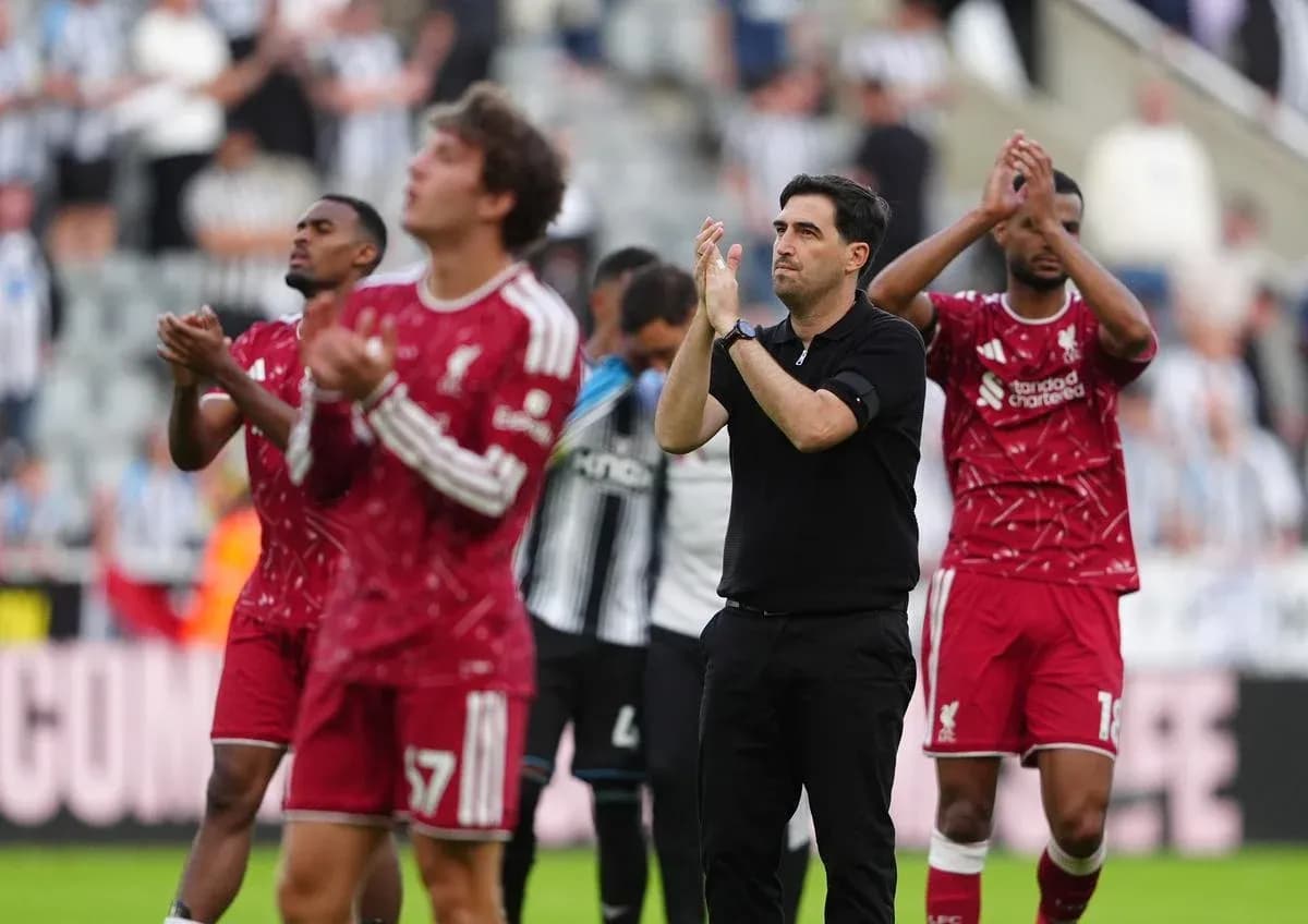 Liverpool players and coach applauding fans after match Liverpool players and coach applauding fans after match