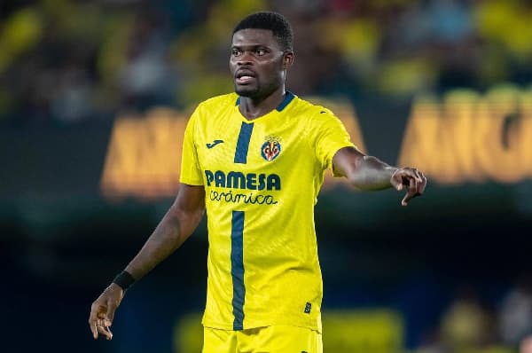Player gesturing during match in yellow jersey Player gesturing during match in yellow jersey