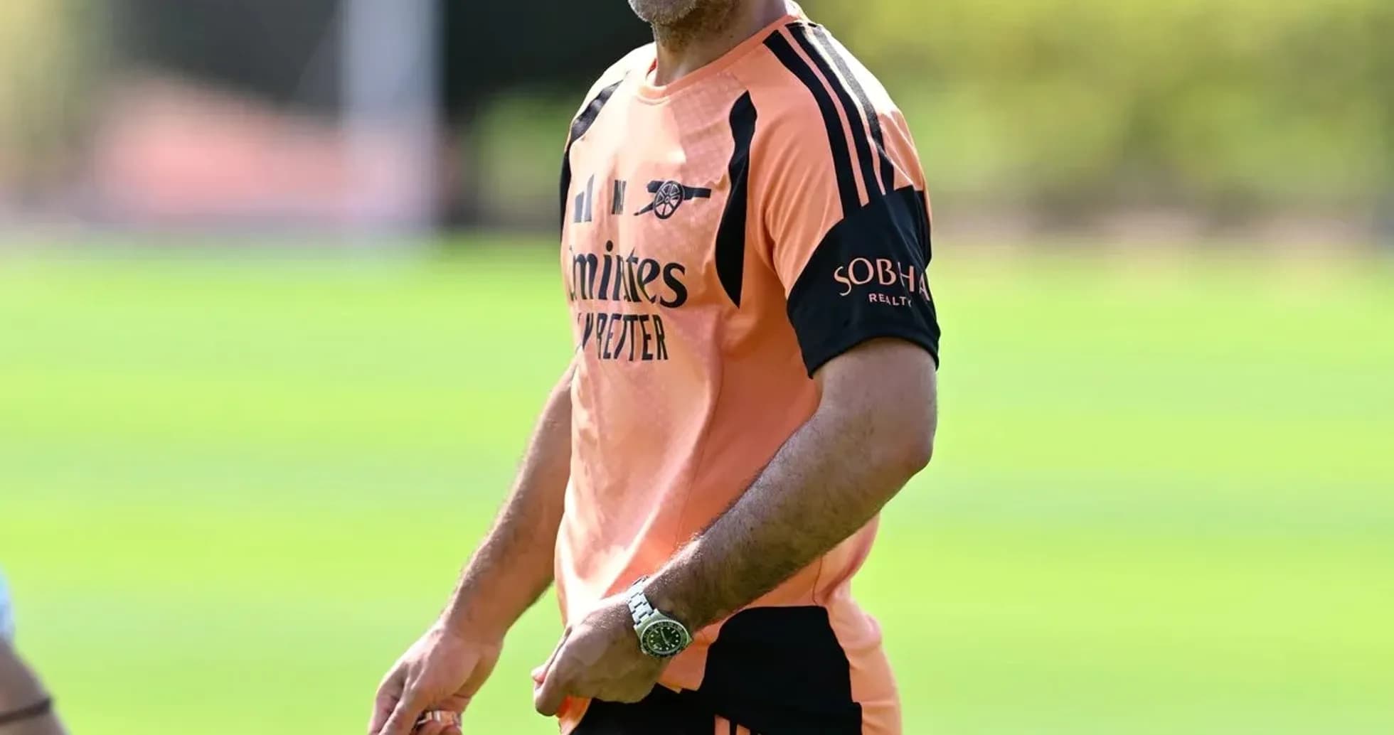 Manager smiling during training session at pitch Manager smiling during training session at pitch
