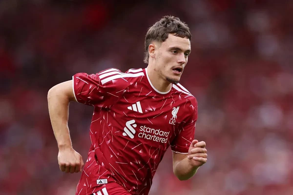 Player running during Liverpool match in red kit Player running during Liverpool match in red kit