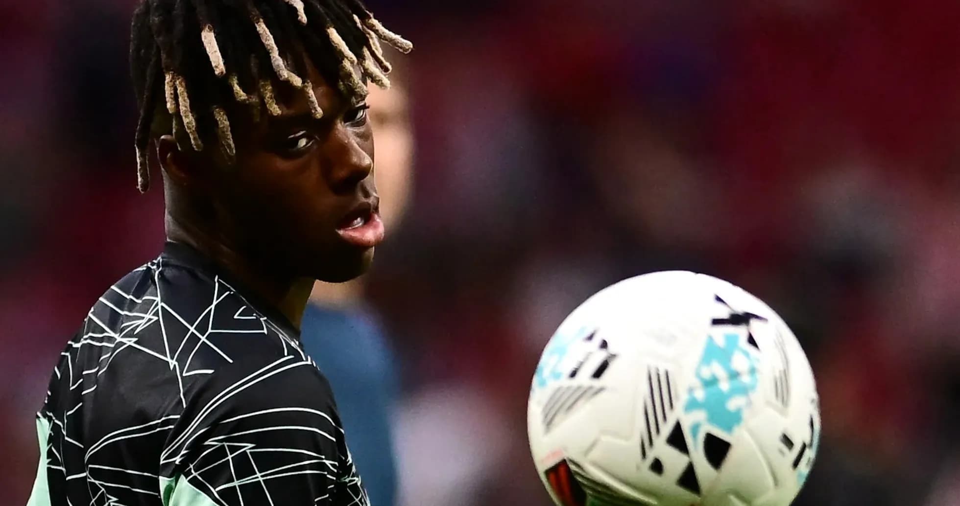 Player practicing with a soccer ball before match Player practicing with a soccer ball before match