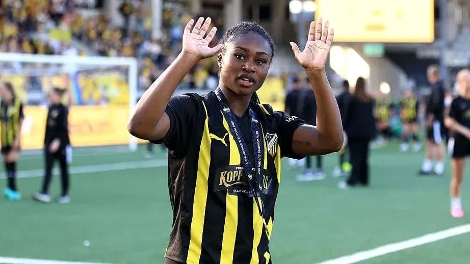 Player waving with hands on football pitch Player waving with hands on football pitch