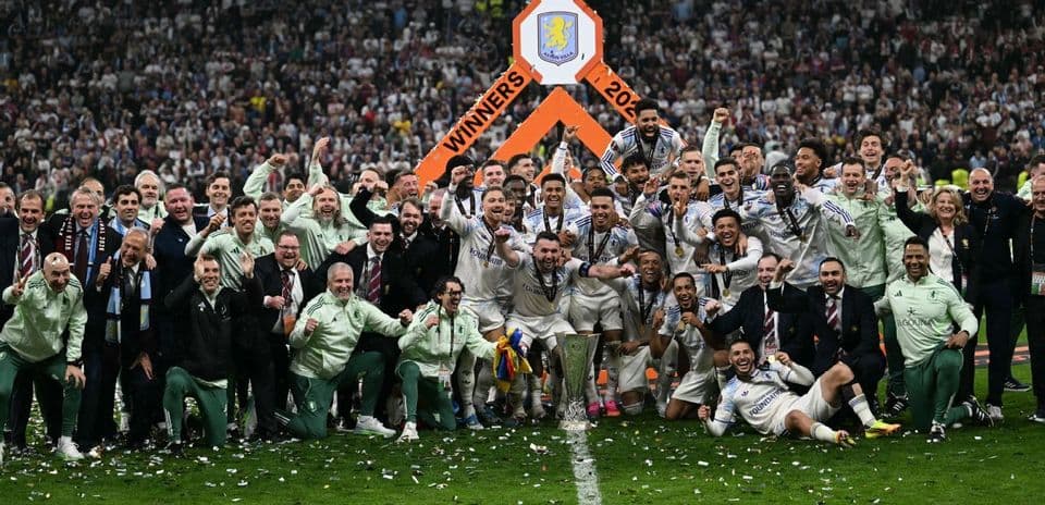 Aston Villa players celebrating victory with trophy Aston Villa players celebrating victory with trophy