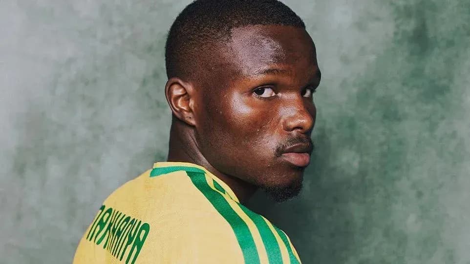 Player in yellow jersey looking back over shoulder Player in yellow jersey looking back over shoulder
