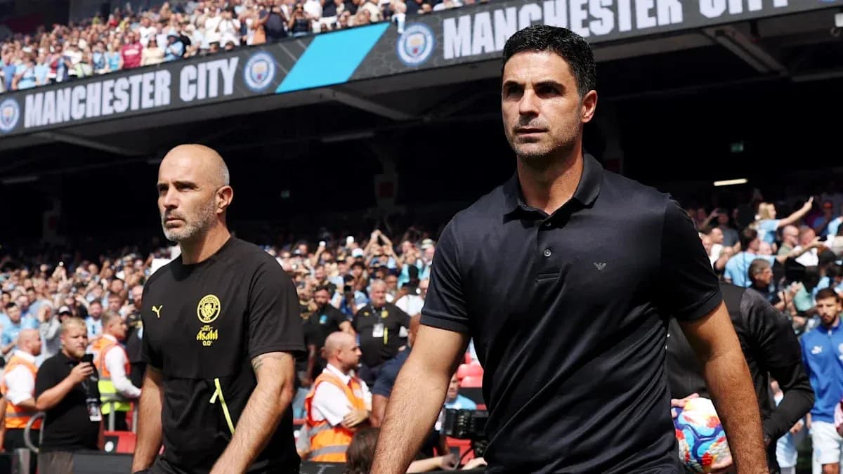 Coaches walking onto the pitch before match Coaches walking onto the pitch before match