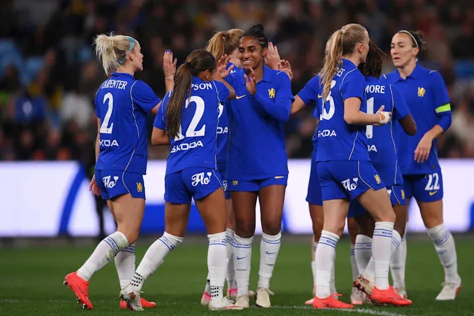 Players celebrating a goal during a match Players celebrating a goal during a match
