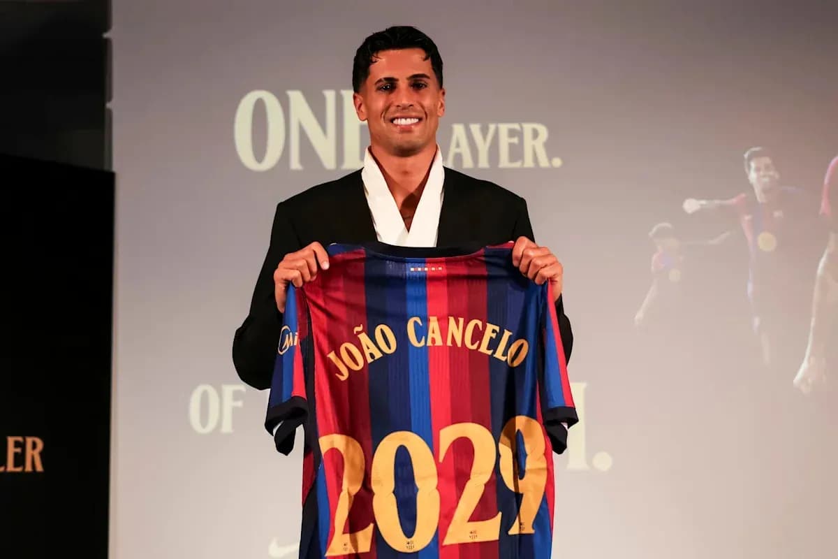 João Cancelo holding Barcelona jersey with 2029 João Cancelo holding Barcelona jersey with 2029
