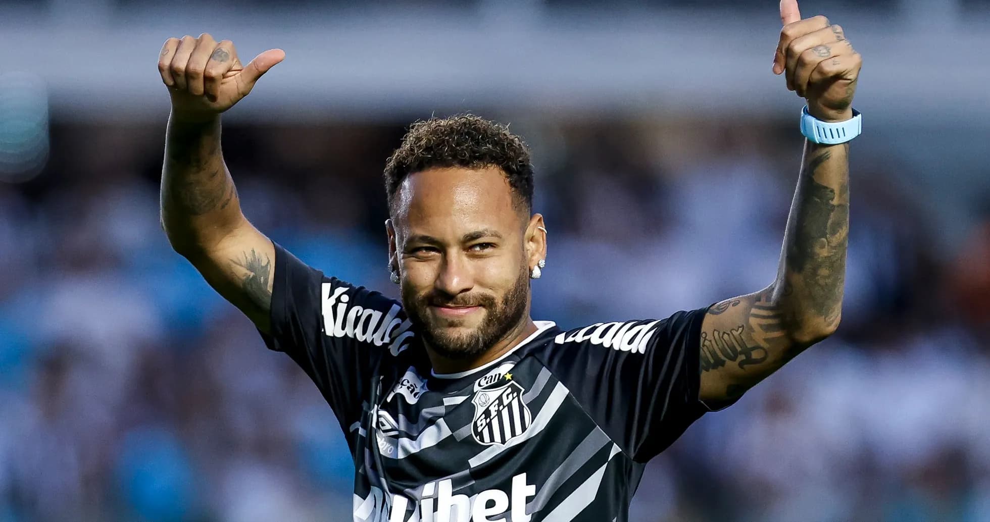 Player celebrating with thumbs up in team jersey Player celebrating with thumbs up in team jersey