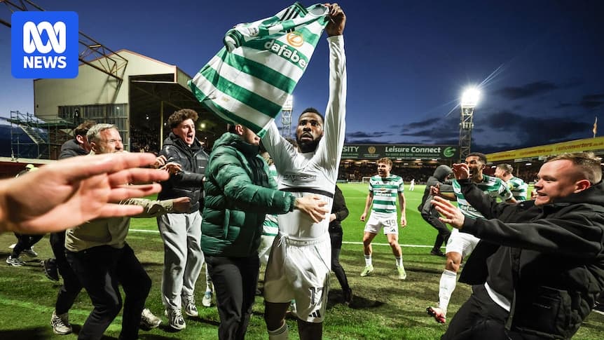 Player celebrating with fans after a match Player celebrating with fans after a match