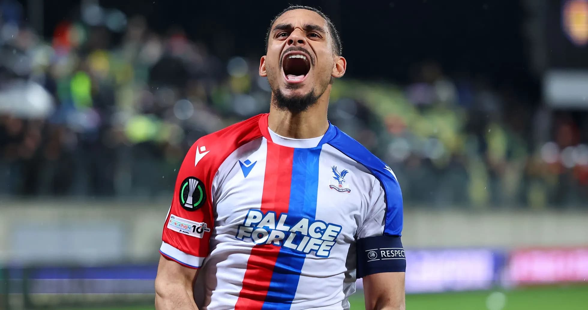 Player celebrating passionately in Crystal Palace kit Player celebrating passionately in Crystal Palace kit