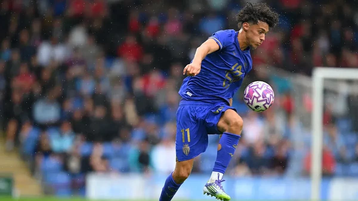 Player in blue jersey controlling ball during match Player in blue jersey controlling ball during match