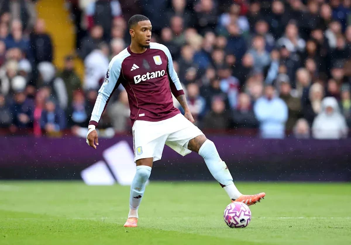 Player in Aston Villa kit preparing to kick ball Player in Aston Villa kit preparing to kick ball