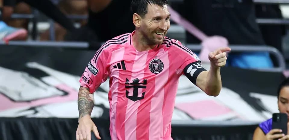 Player celebrating a goal in pink jersey Player celebrating a goal in pink jersey