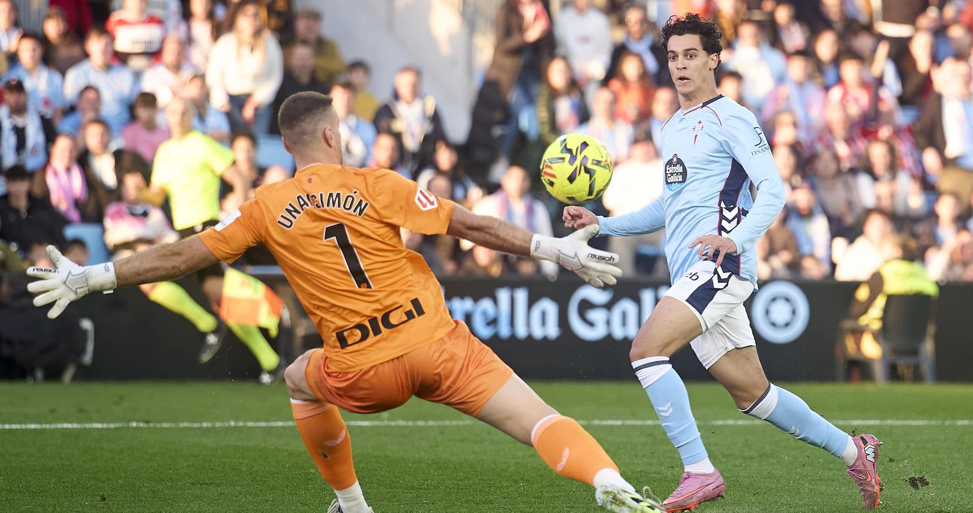 Celta Vigo player attempts to score against goalkeeper Celta Vigo player attempts to score against goalkeeper