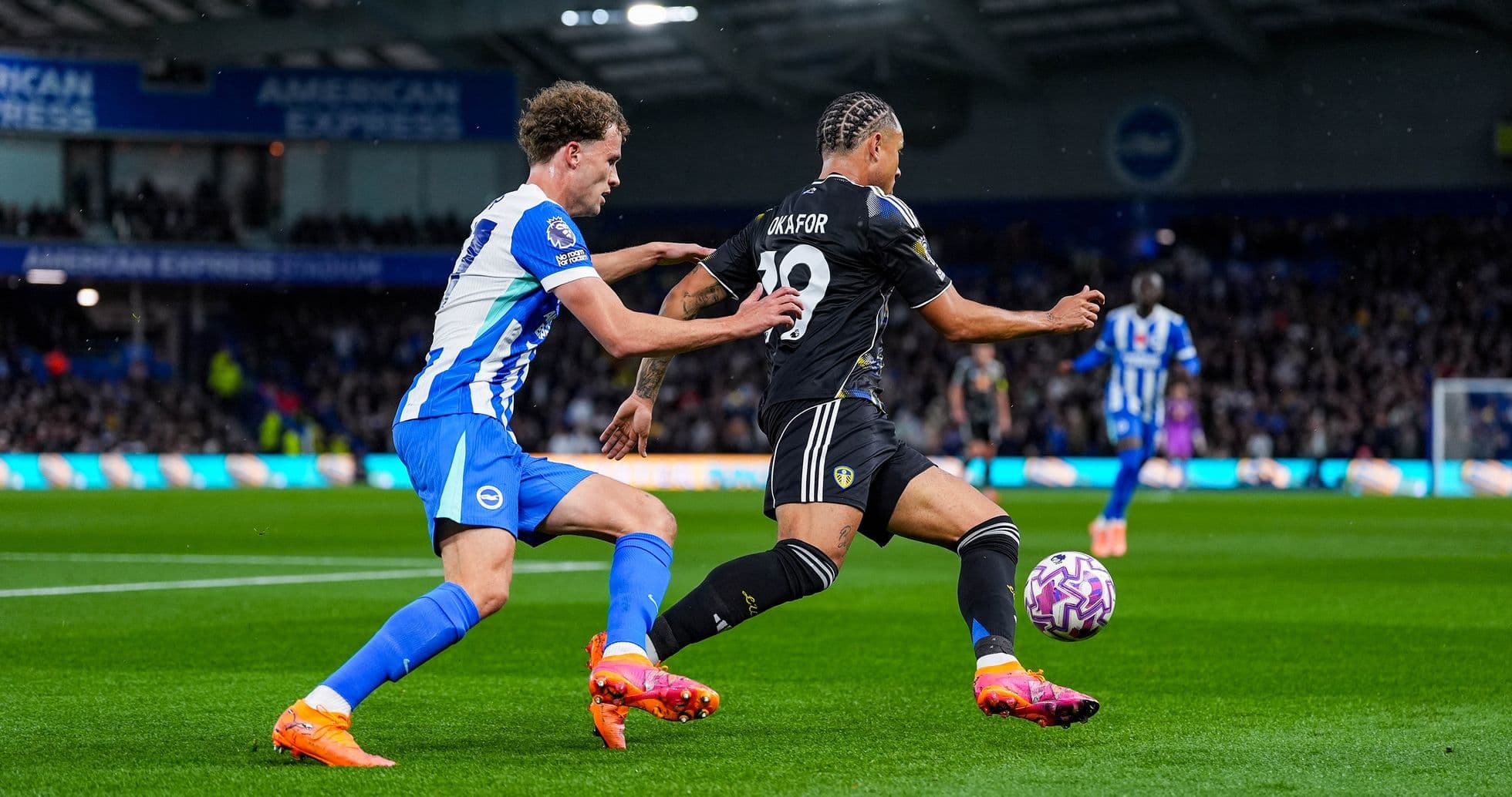 Leeds player tackled by Brighton opponent Leeds player tackled by Brighton opponent