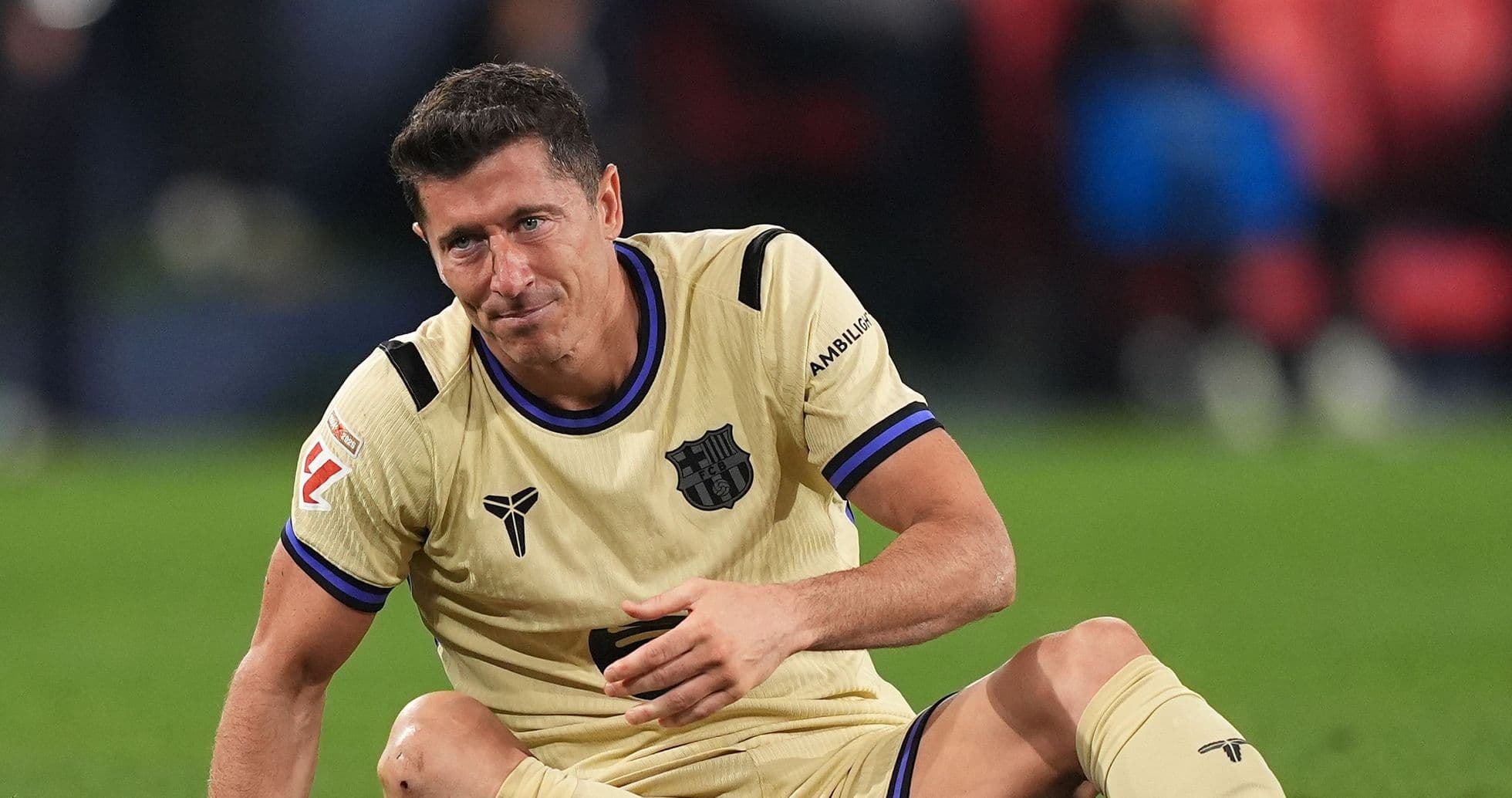 Player sitting on pitch during match Player sitting on pitch during match