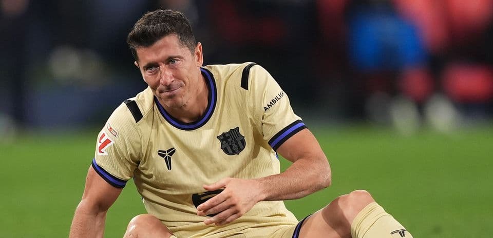 Player sitting on pitch during match Player sitting on pitch during match