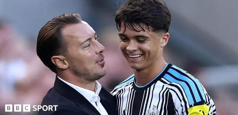 Manager and player celebrating after a match Manager and player celebrating after a match