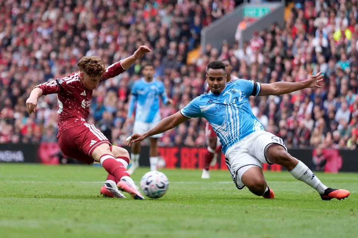 Player tackling another during competitive football match Player tackling another during competitive football match