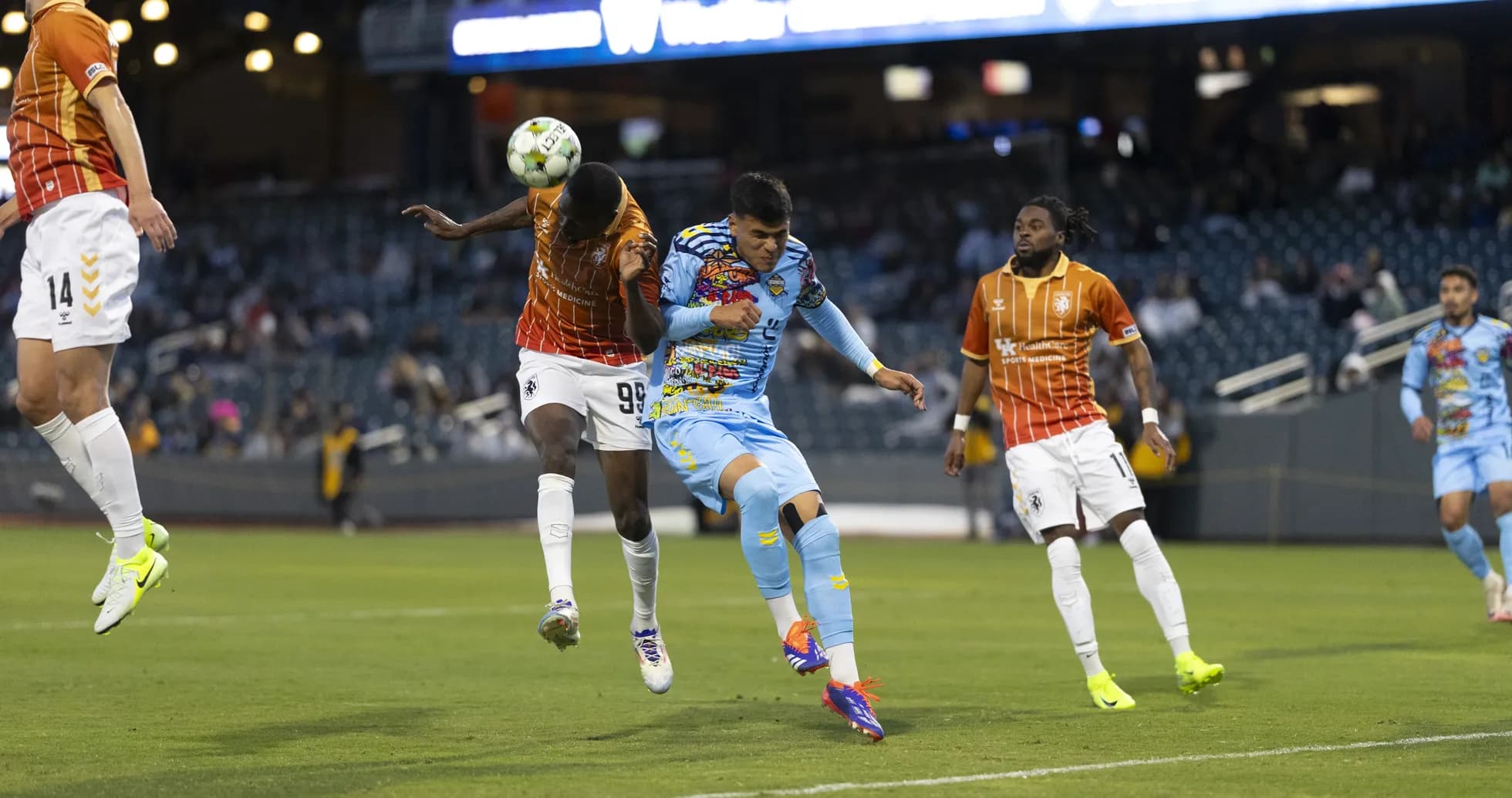 Players competing for the ball during USL match Players competing for the ball during USL match
