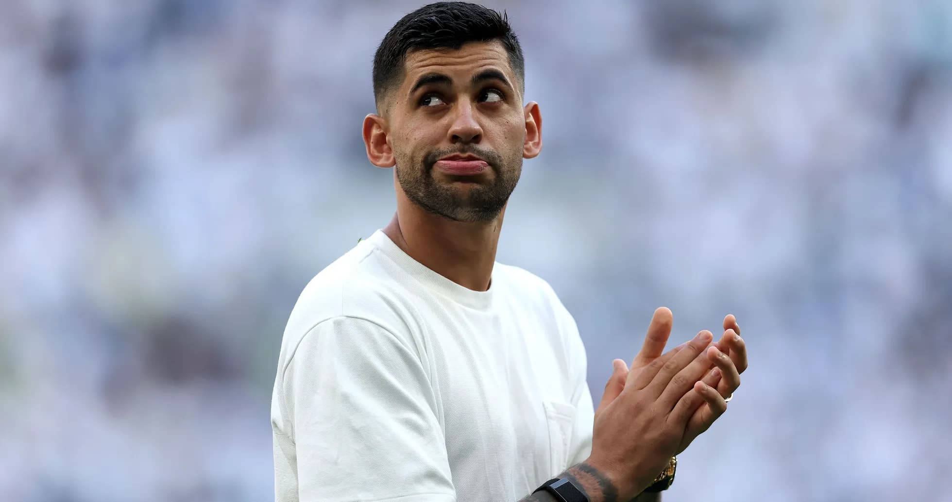 Player applauding fans during a match warm-up Player applauding fans during a match warm-up