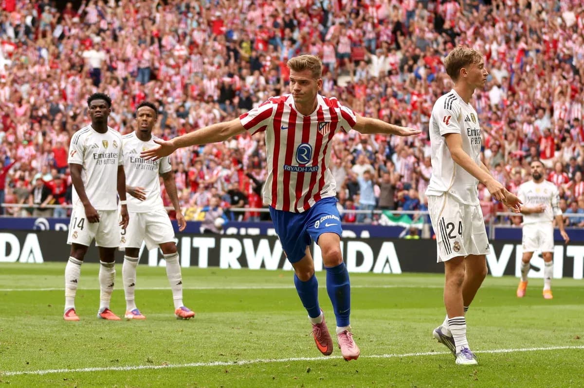 Atletico Madrid player celebrating a goal against Real Madrid Atletico Madrid player celebrating a goal against Real Madrid