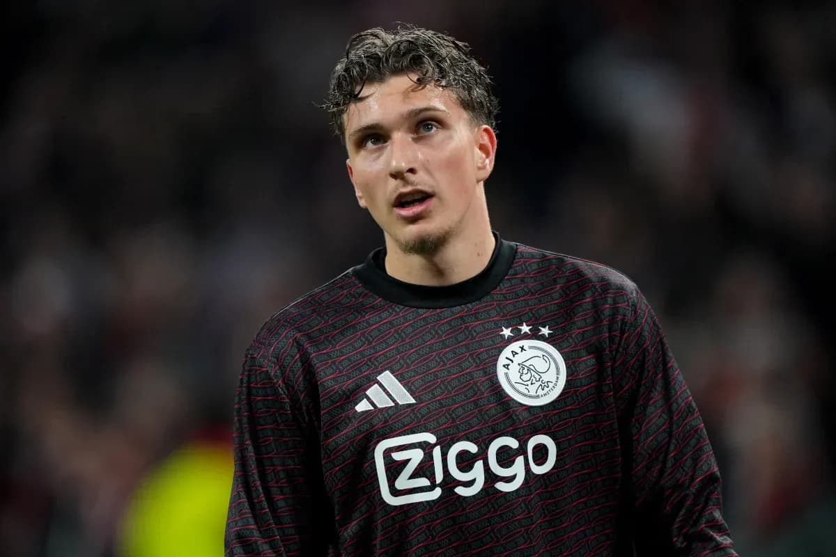 Goalkeeper in Ajax jersey during match action Goalkeeper in Ajax jersey during match action