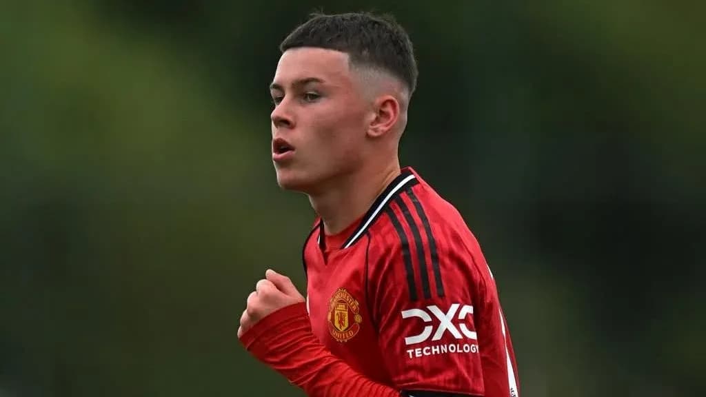 Young player in red Manchester United jersey during match Young player in red Manchester United jersey during match